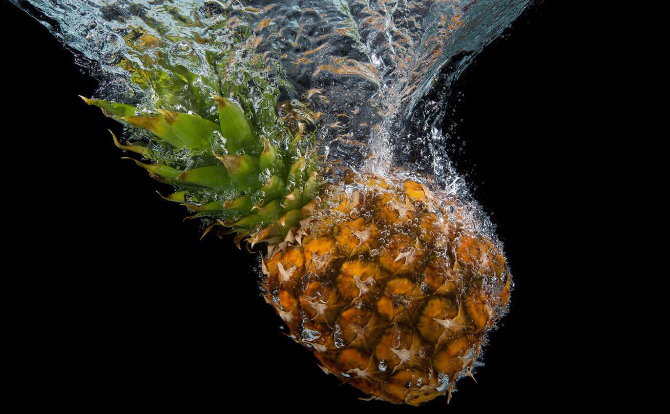 Pineapple dropped into water