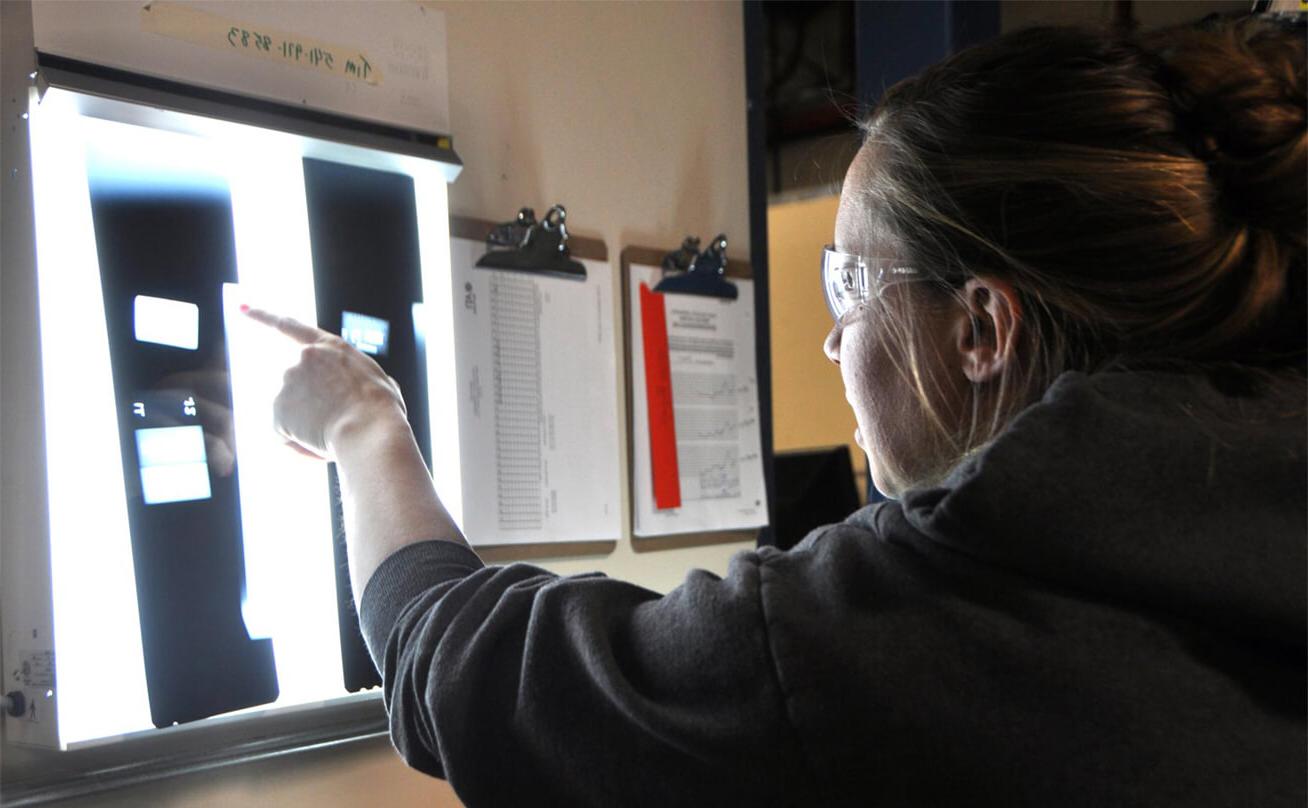 Student pointing to samples on screen
